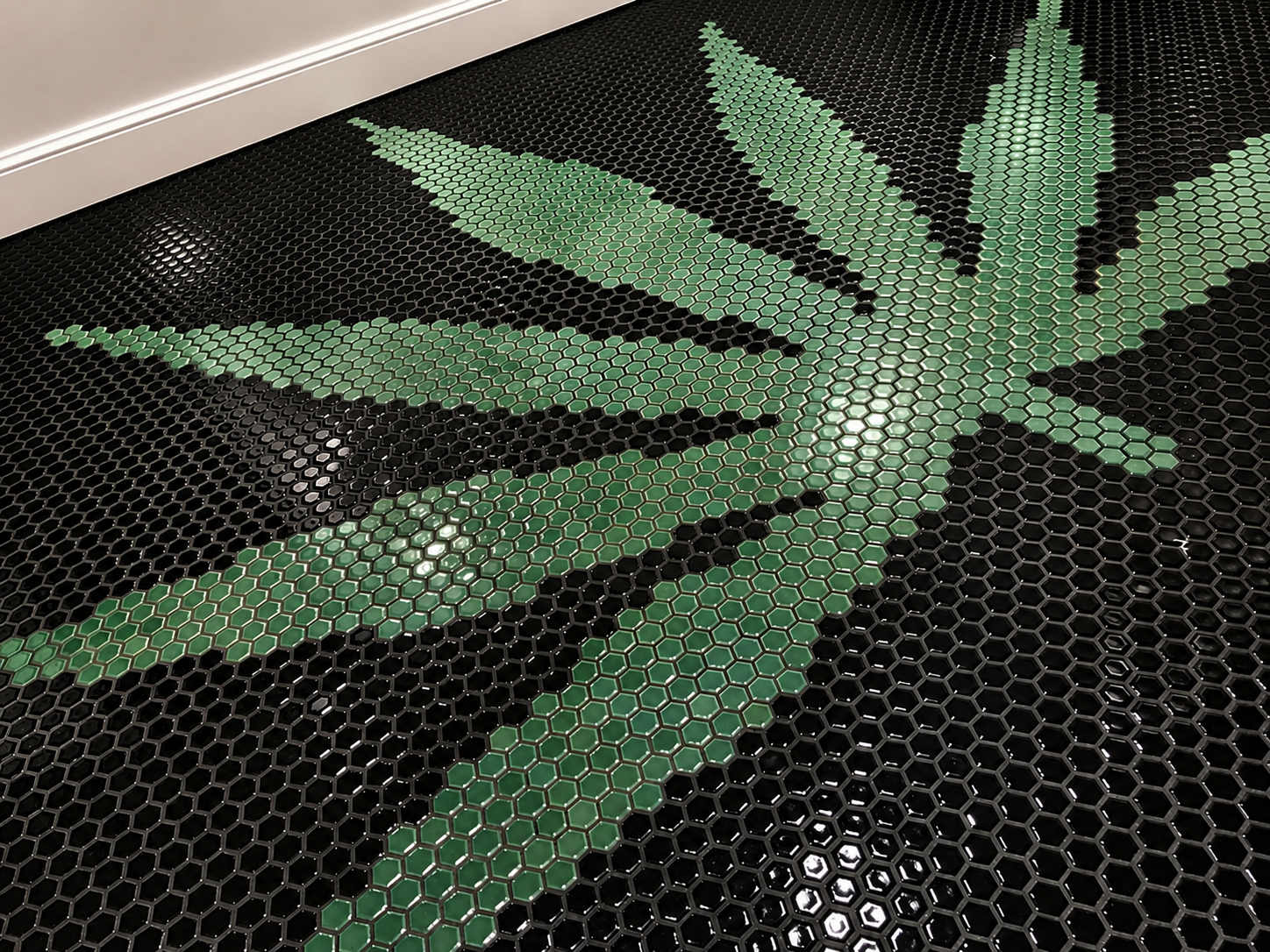 Hand-set custom mosaic tile bathroom floor 8000 Sunset Strip West Hollywood office remodel